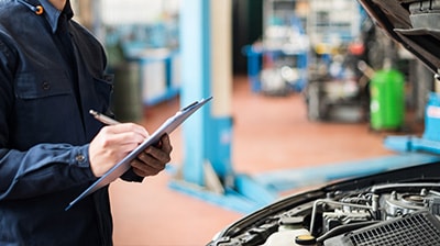 A mechanic working on a car